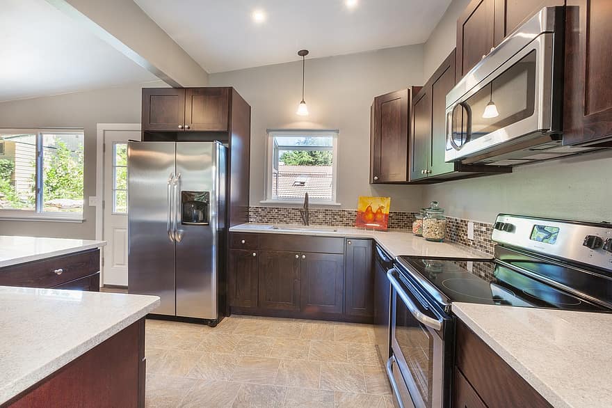 Kitchen Dark Cabinets Dark Cabinetry Stainless Steel Appliances Tile Quartz Counter Lighting