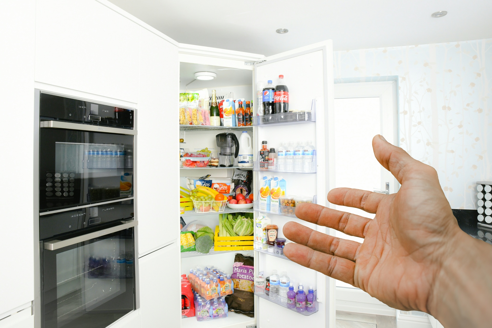 Hand Pointing To Fridge